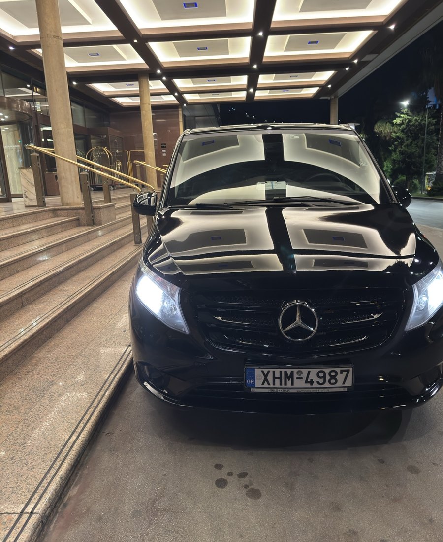 Luxury VIP Transportation Mercedes van at a hotel entrance